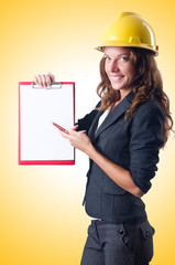 Woman with hard hat and binder