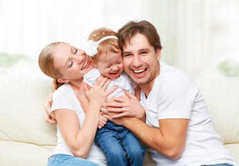 happy family mother, father, child baby daughter at home