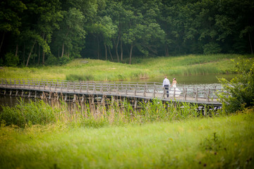 Fototapeta premium beautiful newlyweds in wedding day on the bridge
