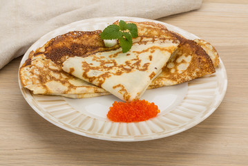 Pancakes with red caviar