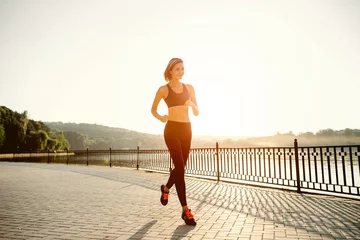 Papier Peint photo Lavable Jogging Running woman. Runner jogging in sunny bright light. Female fitn