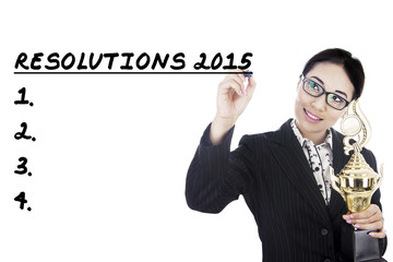 Businesswoman writes her resolutions in 2015