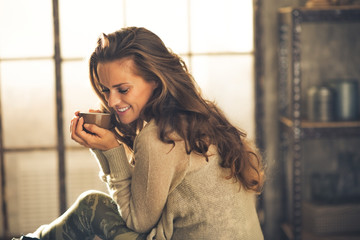 Fototapeta Portrait of relaxed young woman with cup of coffee obraz