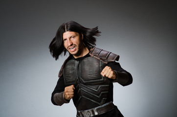 Angry warrior against dark background