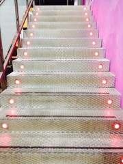 Flight of metal stairs with light