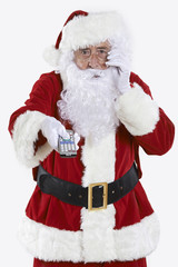 Santa Claus Holding Television Remote Control