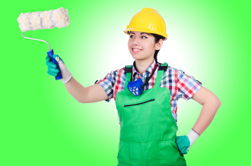 Woman painter with paintbrush on white