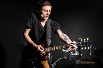 Fototapeta premium Man with guitar during concert