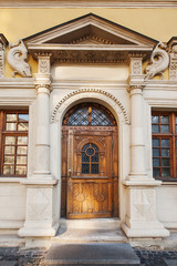 Obraz premium wooden doors, sculptural facade