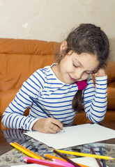 children draw with crayons on paper