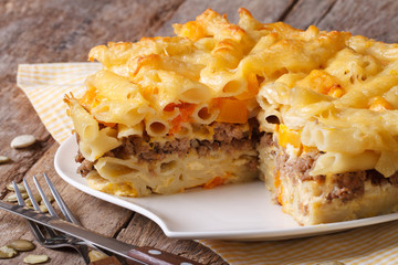 Delicious appetizers: pasta baked with meat and pumpkin