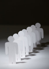 Close up of group of papermen standing in a row