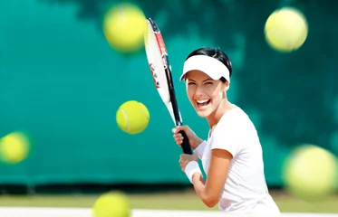 Gordijnen Young woman in sportswear plays tennis at contest © Karramba Production