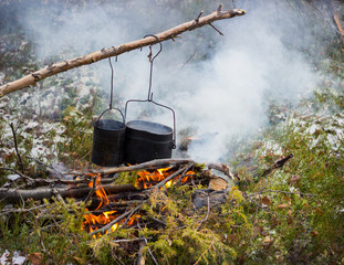 Cooking on a fire in field conditions