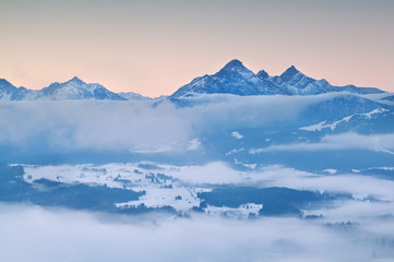 Fototapeta na wymiar Alps in morning winter fog