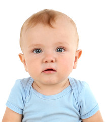 Cute baby boy on carpet in room