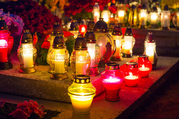 Colorful candles on the cemetery at All Saints Day, Poland