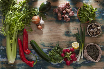 Vegetables, Quail Eggs and Seeds on Rustic Wooden Table