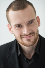 Portrait of young happy smiling business man