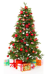 Decorated Christmas tree with gifts isolated on white