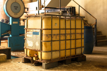 Industrial interior with chemical tanks