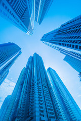 Fototapeta na wymiar High skyscrapers of Dubai blue-toned