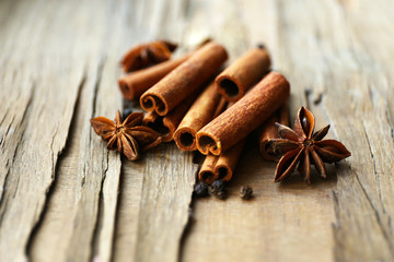 Cinnamon on wooden background, close-up