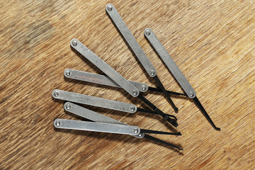 Lock picks on wooden table