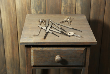 Lock picks on wooden table