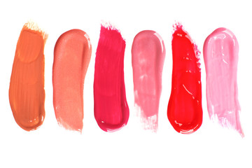 Different lip glosses isolated on white