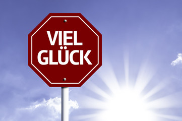 Good Luck (In German) written on red road sign