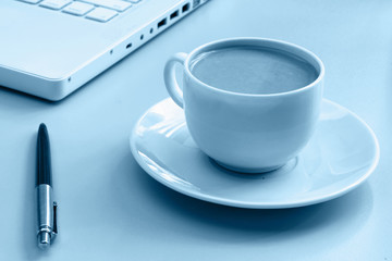 Cup of coffee near press