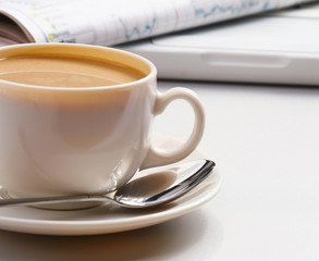 Cup of coffee near press