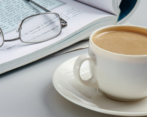 Cup of coffee near press