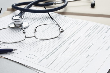 Pen stethoscope and glasses