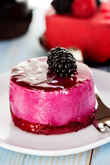 Souffle, cake berry, jelly on the wooden blue background