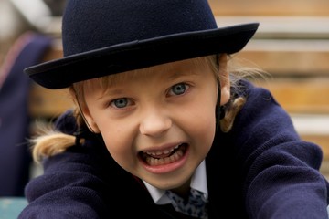 Close-up of little girl pretending to growl