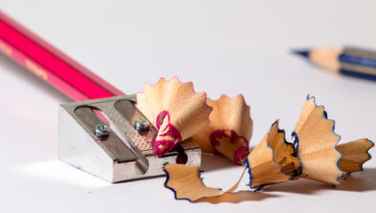 sharpening a red pencil