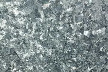 abstract gray background from a frosty pattern on glass