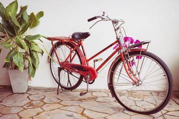Fototapeta na wymiar classic old bicycle decorated with pink flower