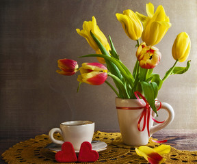 Fototapeta na wymiar Still life bouquet yellow tulips hearts
