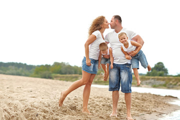 portrait of a happy family in summer nature