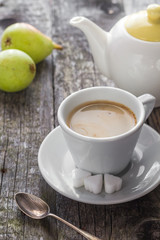 coffee cup black wooden board brown pears white jug