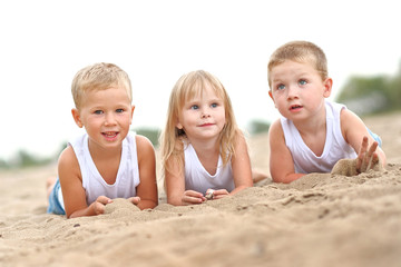 Portrait of children on the beach in summer