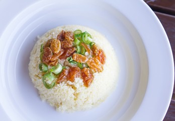 Rice pilaf topped with raisins