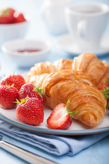 fresh croissants with jam and strawberry for breakfas