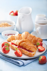fresh croissants with jam and strawberry for breakfast