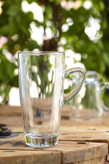 close up empty glass on wooden table in restaurant