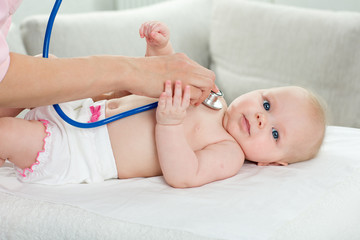 pediatrician inspection of little baby