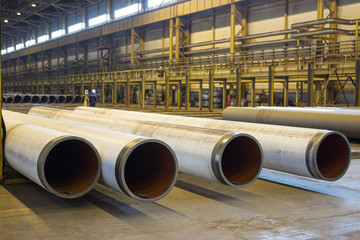 The gas supply pipes of large diameter are stacked in workshop